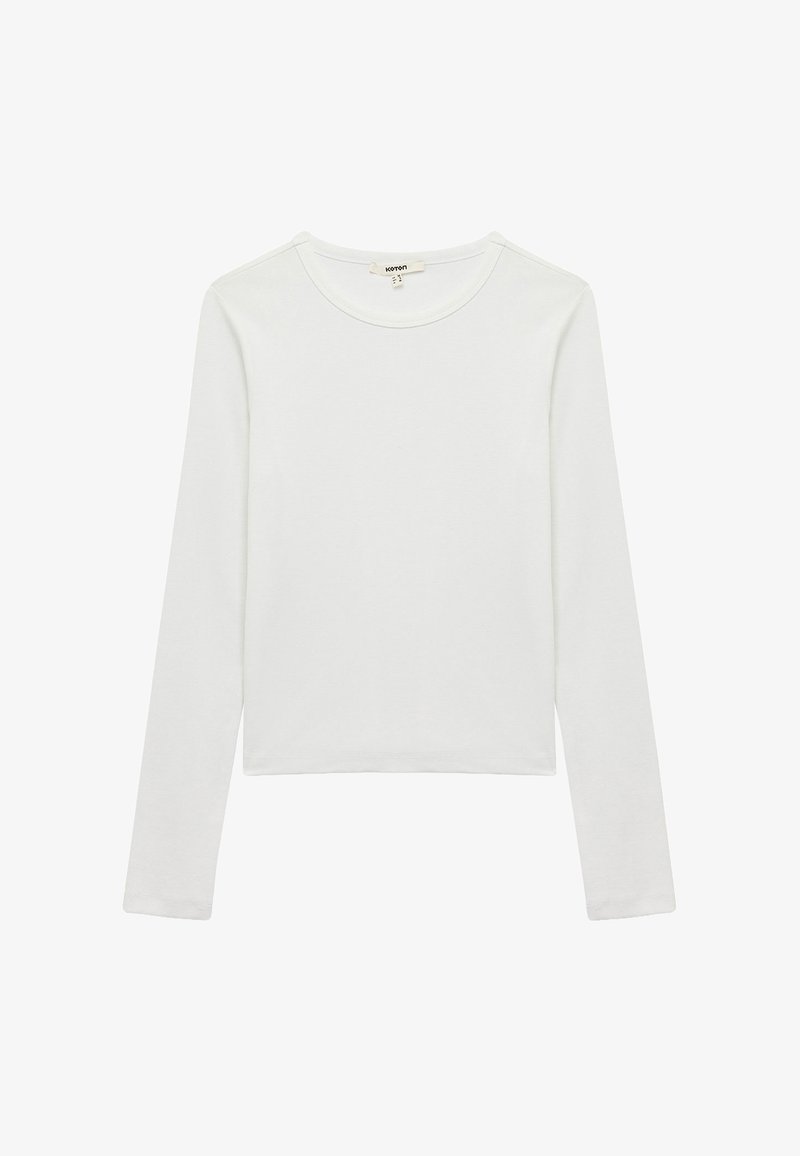 Weißes Langarmhemd aus weichem Baumwollstoff, mit rundem Ausschnitt und leicht verkürztem Schnitt, minimalen Nähdetails.