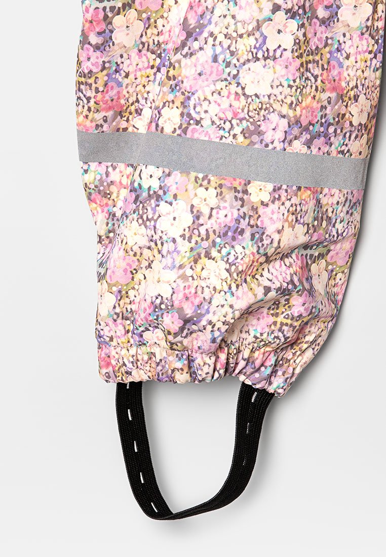 Blumengemusterter Stoff mit elastischem Bündchen und einem schwarzen verstellbaren Riemen, ausgestattet mit einem reflektierenden horizontalen Streifen.