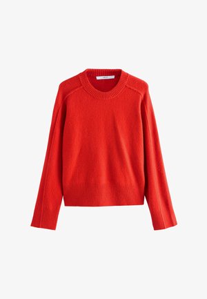 Punane villane sviiter paeluskaelusega, soonikkoes varrukate ja hemiga. Omab pehmet tekstuuri ja veidi lõtvust, sobib kihiliseks kandmiseks.