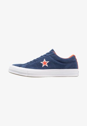 Navy blue suede sneaker with orange accents, white rubber sole, and a red star logo on the side. Features rounded toe and lace-up design.