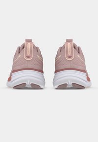 Pink athletic shoes with textured mesh upper, white midsole, rubber outsole, and pull tabs; features contrasting accents and stitching details.