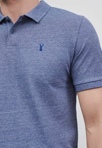 Next Piké - blue marl