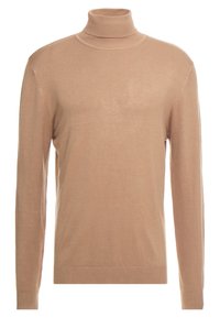 Beige rullekrave sweater lavet af blødt strikket materiale, med lange ærmer og en tætsiddende design med ribbede detaljer ved mansjetter og kant.