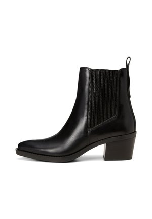 Bottine en cuir noir avec un bout pointu, des panneaux latéraux en élastique texturé et un petit talon carré pour plus de stabilité.