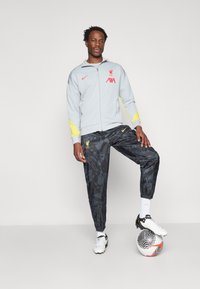 Nike Performance LIVERPOOL FC NIKE DF ACADEMY TRACK JACKET K THIRD - Klubbklær - light smoke grey/chrome yellow/global red
