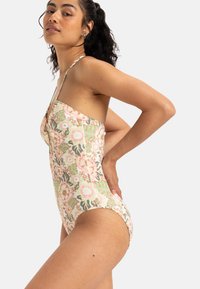 Bloemige eendelige swimsuit met een pastelkleurenpalet, dunne verstelbare banden en een aansluitend ontwerp met een hoge uitsnijding bij het been.