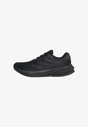Black athletic shoes with a mesh upper, streamlined shape, flat sole, and three diagonal stripes on the side. Lightweight design for comfort.