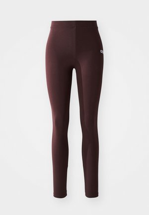 Leggings de sport bourgogne avec une texture lisse, taille haute et un petit logo blanc sur le côté gauche. Conçus pour le confort et la flexibilité.