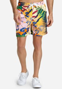 Colorful swim shorts featuring a mix of tropical prints in pink, orange, blue, and green. Lightweight fabric and elastic waistband with drawstring.