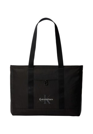 Sac cabas noir Calvin Klein avec deux longues poignées et une poche avant, avec le logo de la marque en blanc et gris.
