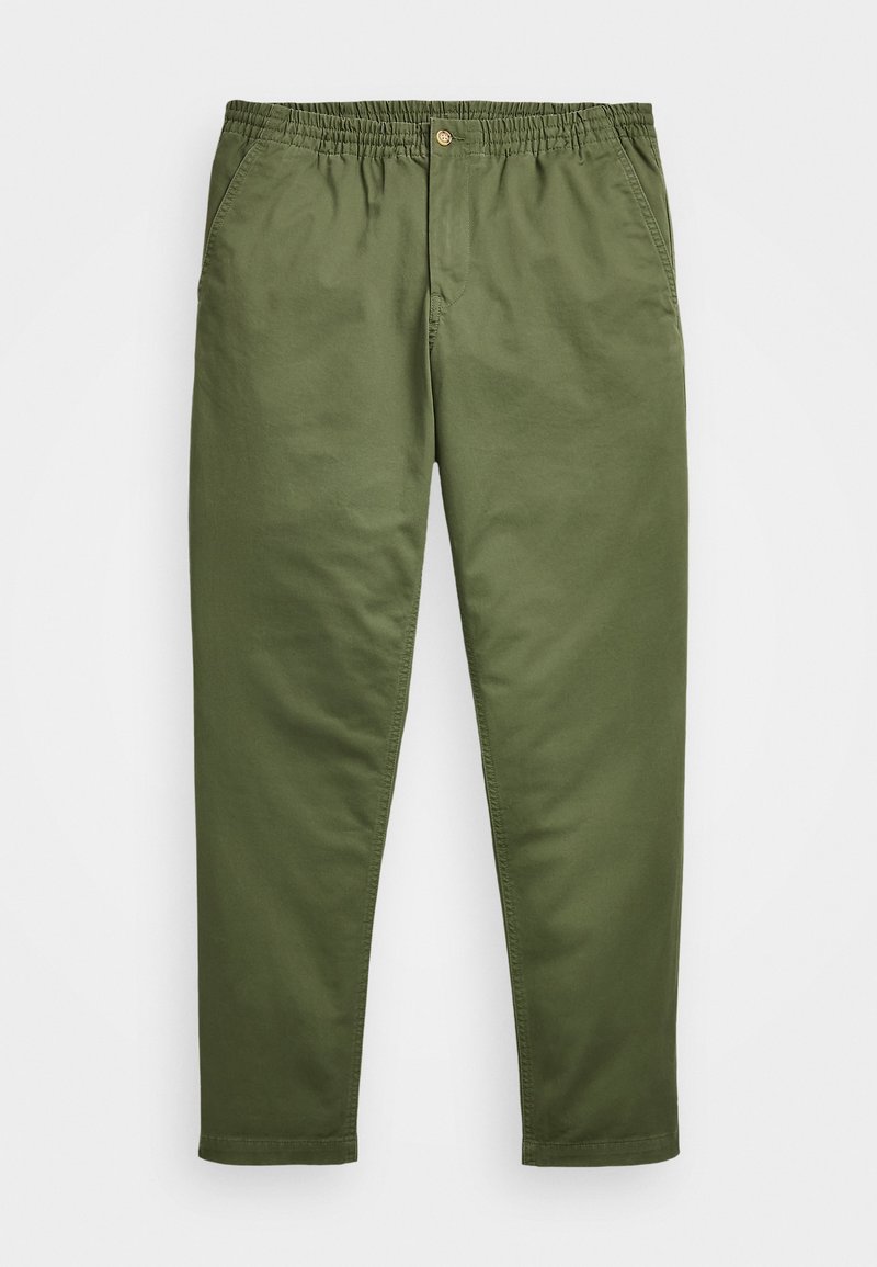 Pantalon en coton vert avec ceinture élastique, fermeture par un seul bouton, poches latérales et jambes fuselées. Présente un tissu lisse et une couture minimale.
