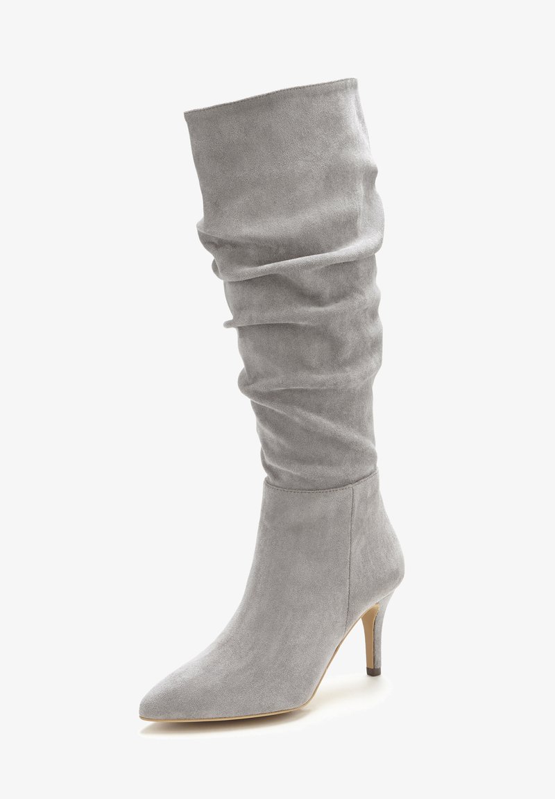 Gray suede knee-high boot with a slouchy design, pointed toe, and a slender heel. Soft texture with smooth finish and minimal detailing.