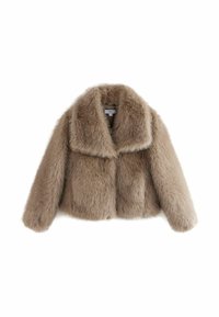 Veste courte en fausse fourrure beige avec manches longues et large col, étiquetée "Next", présentée sur fond blanc.