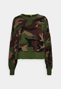 Cropped sweatshirt in camouflage print with shades of green, brown, and black. Features a round neck and ribbed cuffs. Small logo detail.