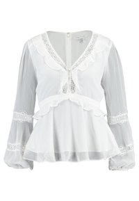 Weiße Peplum-Bluse mit langen, transparenten Ärmeln, gerafftem Ausschnitt und Spitzen-Details. Verfügt über einen Reißverschluss auf der Rückseite und eine strukturierte Stoffoberfläche.