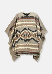 Beiger Poncho mit geometrischen Mustern im südwestlichen Stil in Braun, Creme und Grau. Weicher Stoff, weite Ärmel und ein runder Ausschnitt.