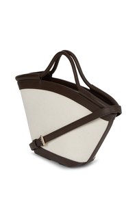 Käekott, millel on kreemivärvi kangas ja tumepruun nahkkate. Sellel on ainulaadne kumer kuju ning kaks ülemist sangas, mis on mõeldud kandmiseks.