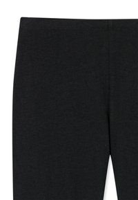 Czarne legginsy wykonane z miękkiego, elastycznego materiału. Posiadają gładki pas i jednolite, matowe wykończenie bez widocznych wzorów czy detali.