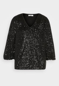 Haut noir à manches longues avec un col en V, recouvert de sequins noirs brillants, avec une coupe ample et des manches légèrement bouffantes.