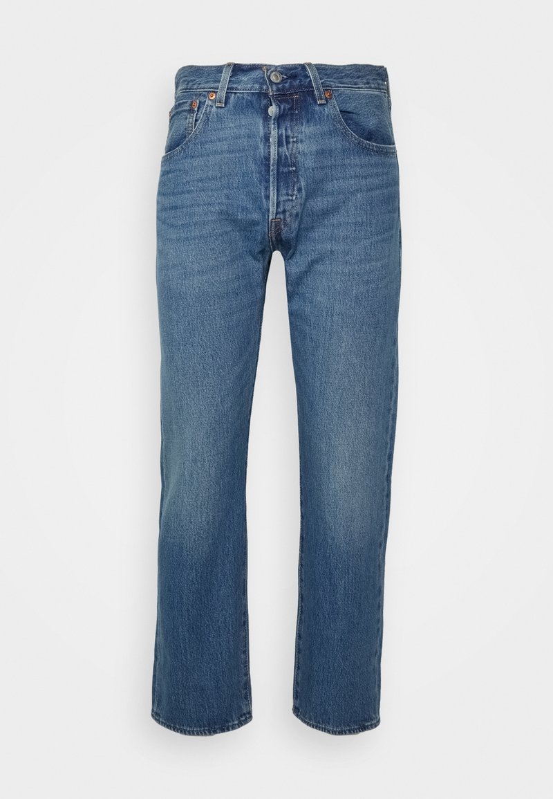Jean en denim bleu avec une coupe droite, doté d'une braguette zippée, cinq poches et un léger délavage pour la texture. Détails classiques cousus.