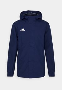 Marinblå Adidas-hoodie med elastiska muddar, frontdragkedja täckt av en flik och vit Adidas-logotyp på vänster bröst.