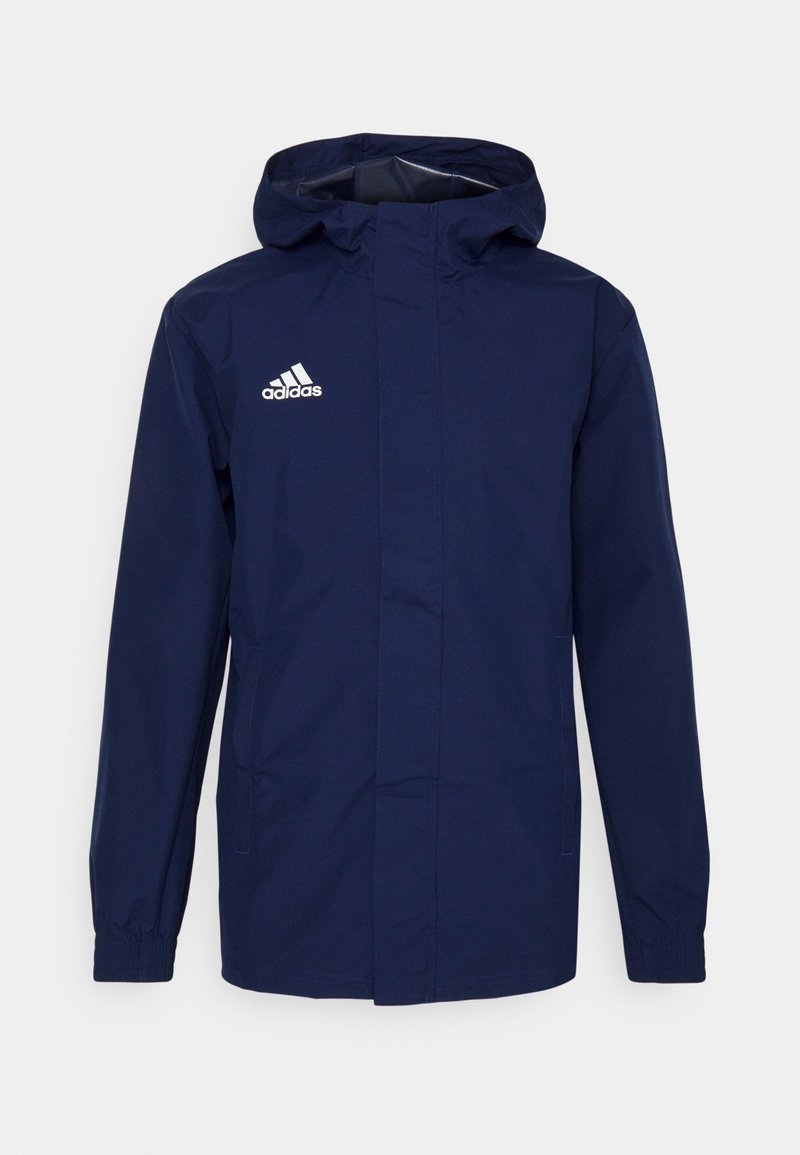 Marinblå Adidas-hoodie med elastiska muddar, frontdragkedja täckt av en flik och vit Adidas-logotyp på vänster bröst.