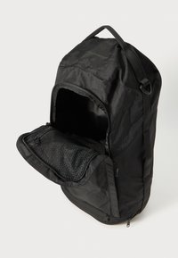 Black fabric backpack with a textured surface, featuring a large opening and a front zippered mesh pocket for organized storage.