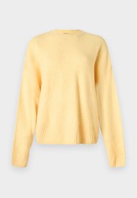 Pull jaune doux à col rond, manches longues, poignets et ourlet côtelés, présenté sur un fond neutre.