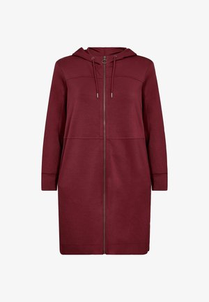 Burgundin värinen hupullinen vetoketjullinen takki, joka on valmistettu pehmeästä kankaasta. Takissa on etutaskut, pitkät hihat ja nauha hupun säätämiseen.