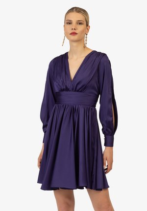 Purple satin dress with a deep V-neck, long balloon sleeves, and a gathered waist, featuring a flowing skirt and buttoned cuffs.