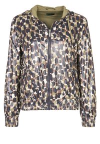 Hupparillinen takki kiiltävästä, kuvioidusta kankaasta, jossa on sävyjä ruskeaa, vihreää ja tummaa sinistä. Takissa on vetoketju edessä sekä kuminauhoitetut hihansuut ja helma.