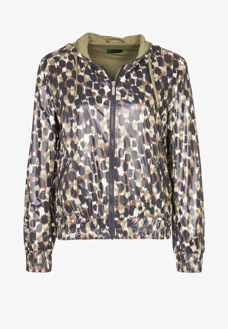 Hupparillinen takki kiiltävästä, kuvioidusta kankaasta, jossa on sävyjä ruskeaa, vihreää ja tummaa sinistä. Takissa on vetoketju edessä sekä kuminauhoitetut hihansuut ja helma.