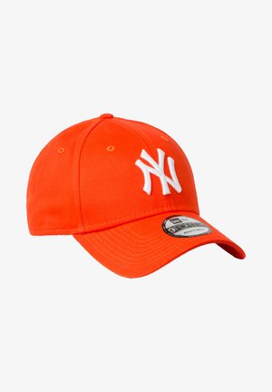 Orange baseball cap made of cotton with white embroidered logo, curved visor, and adjustable strap at the back. Displayed at an angle.