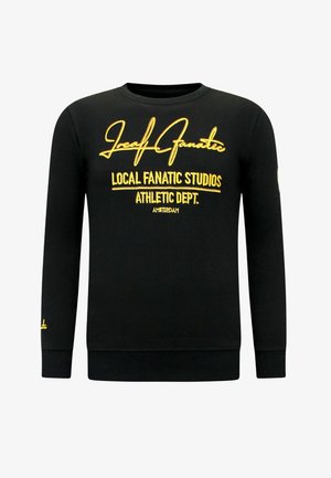 Zwarte katoenen sweat shirt met gele geborduurde tekst. Ronde hals, lange mouwen, geribbelde manchetten en tailleband.