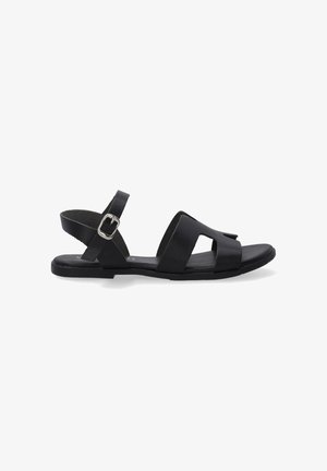 Zwarte leren sandalen met een platte zool, voorzien van twee brede tebandjes, een achterband en een verstelbare gesp voor een goede pasvorm.