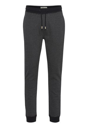 Black jogger pants featuring a textured fabric, drawstring waistband, and black ribbed cuffs. Sleek and modern design with minimal pattern.
