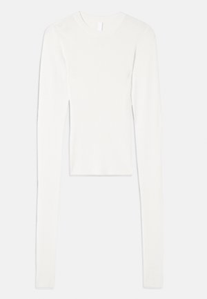 Long-sleeve white ribbed top with a round neckline, slim fit, and smooth texture, featuring elongated sleeves and a cropped length.