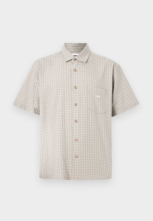 Short-sleeve button-up shirt in beige and cream checkered pattern, featuring a pocket on the left chest and brown buttons. Made of lightweight fabric.