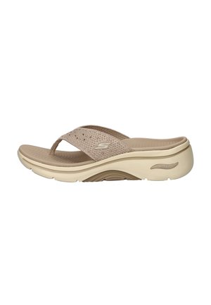 Beige Skechers Arch Fit sandal with textured footbed, cushioned sole, and woven fabric thong strap with logo on side.