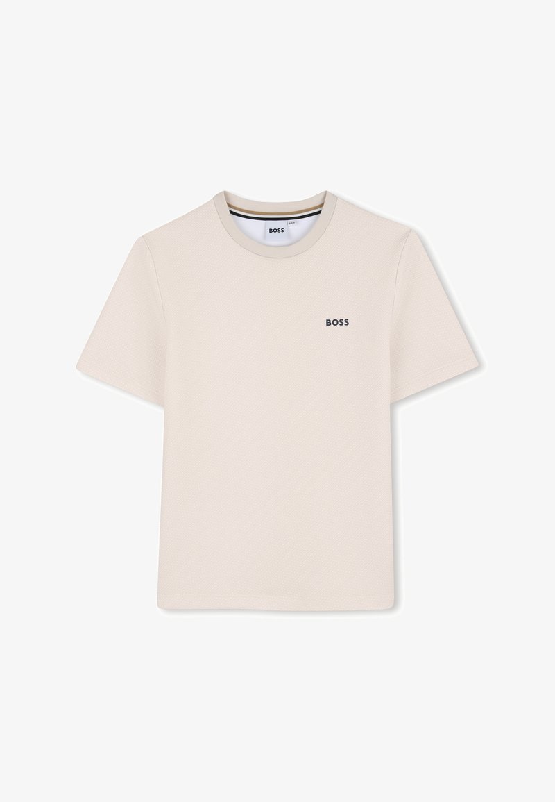 T-shirt beige clair à manches courtes avec un motif texturé et un col rond. Présente un petit logo "BOSS" brodé sur la poitrine.