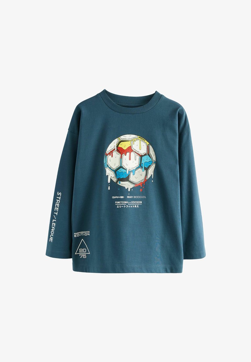 T-shirt in cotone turchese a maniche lunghe con una grafica colorata di un pallone da calcio che colpisce e testi accentuati sulle maniche e l'orlo.