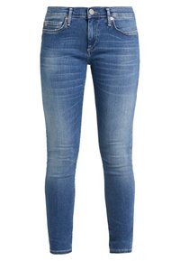 Jeans skinny blu in denim, con chiusura a bottone, cinque tasche e una leggera scoloritura per un aspetto usurato.