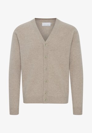 Beige cardigan laget av mykt stoff, med v-hals, syv knapper, ribbede mansjetter og nederkant, med en glatt tekstur.