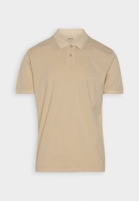 Polo beige en coton, avec un col classique, une patte de boutonnage à trois boutons et des manches courtes, présentant une texture lisse.