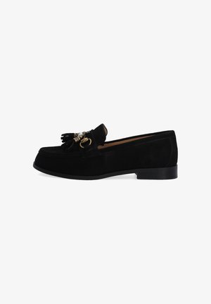 Sorte ruskinds loafers med en dekorativ kvast og detaljer i guld-tone. De har en flad sål og en glat, struktureret overflade.