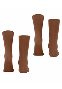 Braune Knöchelsocken aus einem glatten, dehnbaren Material. Sie haben einen gerippten Bund und ein nahtloses Zehendesign für zusätzlichen Komfort.