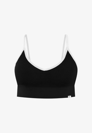 Bralette noire côtelée avec bordure blanche, fines bretelles réglables et petite étiquette de marque blanche en bas à gauche.