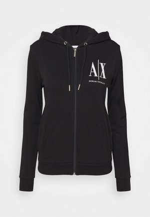 Sweat à capuche zippé noir avec capuche et cordons de serrage, poches avant, et logo blanc "A|X Armani Exchange" sur le côté gauche de la poitrine.