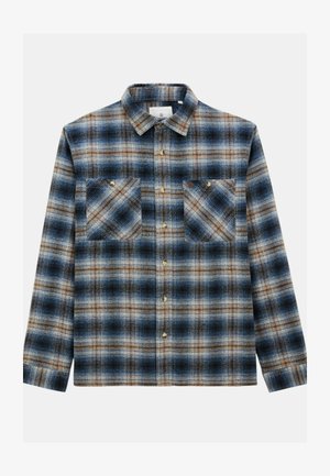 Chemise en flanelle à carreaux bleu, marron et crème. Dispose d'un col boutonné, de deux poches poitrine avec rabats et de boutons de fermeture.