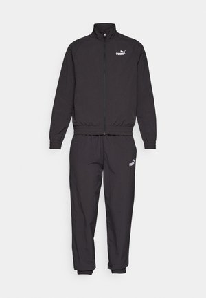 Sort træningsdragt med en lynlåsjakke, der har en stående krave, og bukser med elastisk talje. Fremstillet af letvægtsmateriale med PUMA-logo detaljer.